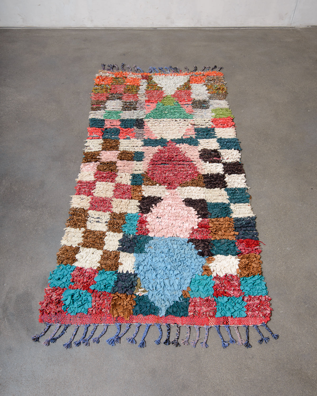 Modern designer vintage handcrafted Berber rug from Morocco. Boucherouite runner rug with beautiful colors and patterns.
